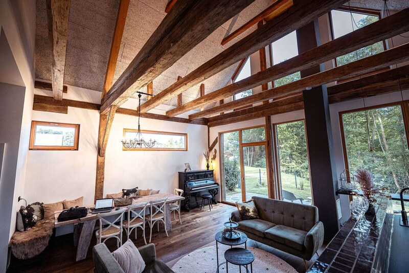 Open-concept living area with a piano